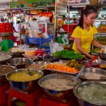 Another food stall manager, with diverse desserts from Cambodia, Vietnam, and China.
