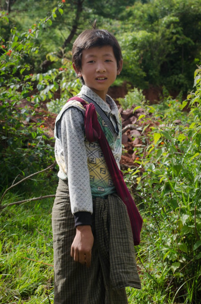 A boy from the Palaung people, one of the numerous ethnic groups of Myanmar, herding his buffalos when we met him.