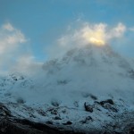 The clouds give an eerie atmosphere to the top of Annapurna South, at dawn