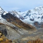 Panorama of (from left to right) Annapurna South (7,219 m), Barha Chuli (7,647 m) and Annapurna I (8,091 m). The South Annapurna Glacier, covered with rocks and gravel, spans toward us from the foot of Annapurna I.