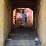 A proud boy poses on the stairs